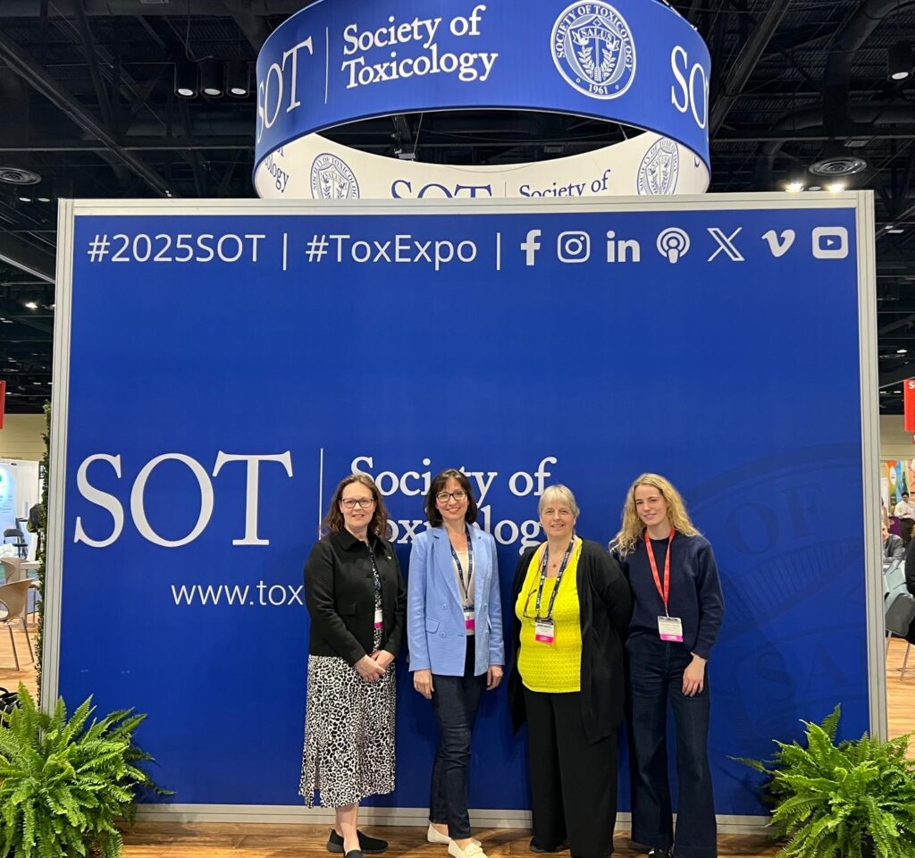 Society of Toxicology event 2025, Platelet Services team next to a blue SOT poster